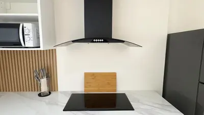 a kitchen with a microwave and a counter top at Mali Villa 57 in Patong Beach