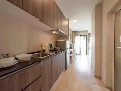 a kitchen with a sink and a counter top at Apartments in the NICE condominium on Bang Tao Beach in Ban Thalat Choeng Thale