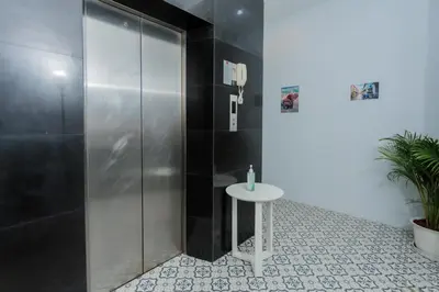 a shower stall with a table in a bathroom at sunflower \u4e00\u5367\u7cbe\u54c1\u5927\u5e8a\u623f\u5e26\u9633\u53f0 in Patong Beach