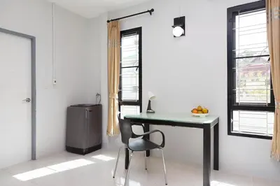 a desk with a chair in a room with a window at House in a quiet and stylish location NU8, Bang Tao in Surin Beach