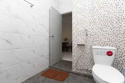 a bathroom with a toilet and a walk in shower at Lovely OPTIC apartments on Bang Tao Beach in Ban Thalat Choeng Thale