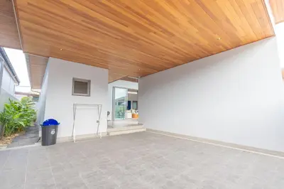 an empty patio with a wooden ceiling at The S Villas in Laguna Phuket