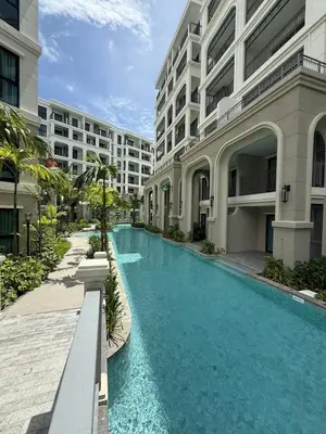 a swimming pool in the middle of a building at New and Stunning 1BR, The Title Legendary by UNO in Bang Tao Beach