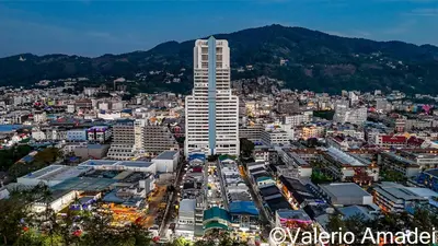 a city with a tall building in the middle at OMNIAPHUKET - Sea View Patong Tower - Top Location & Sea View in Patong Beach
