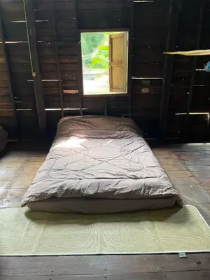 a large bed in a room with a window at Balance home happy in Ko Yao Noi