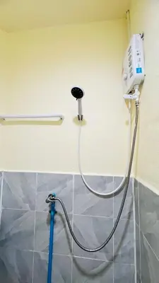 a blow dryer is attached to a wall at Daisy House Patong in Patong Beach