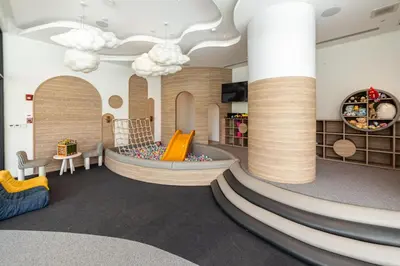 a childrens play area with a slide in a room at Laya Resort 1 bedroom By Ere in Layan Beach