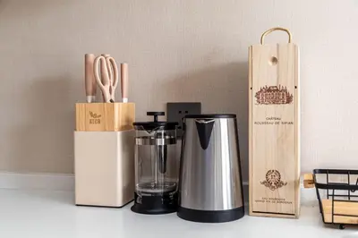 a kitchen counter with a coffee maker and wooden boxes at Laya Resort 1 bedroom By Ere in Layan Beach