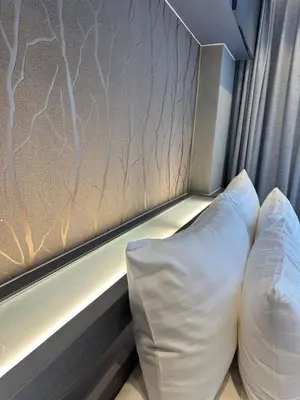 a pillow sitting next to a window in a room at CityGate Kamala 1 bedroom by Ere B312 in Kamala Beach