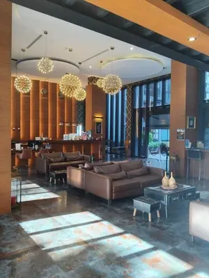 a large living room with couches and a kitchen at CityGate Kamala 1 bedroom by Ere B312 in Kamala Beach