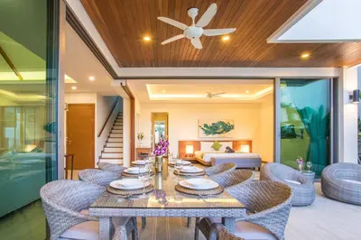 a dining room with a table and chairs at Private Pool 4BR Villa Kari next to Rawai Beach in Rawai Beach