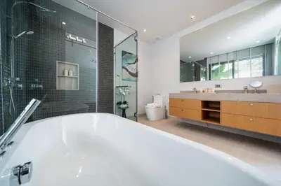 a large bathroom with a tub and a shower at Villa Beautiful swimming pool in Phuket