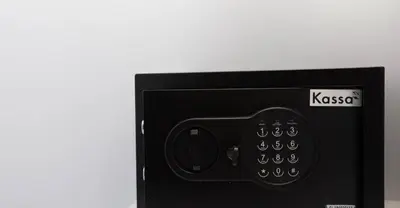 a small black microwave with the words kiscosa on it at Siam Condo Apartment, 600 metters to Bang Tao beach in Surin Beach
