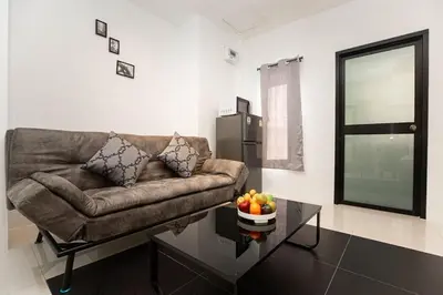 a living room with a couch and a coffee table at SOMAN apartments Bang-Tao beach in Phuket Town