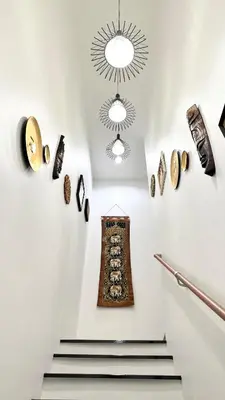 a staircase in a building with a chandelier at Stylish Family Townhouse 3 Bdr in Chalong