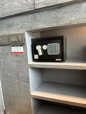 a cash register on a shelf in a room at CityGate Kamala 1 bedroom By Ere L309 in Kamala Beach