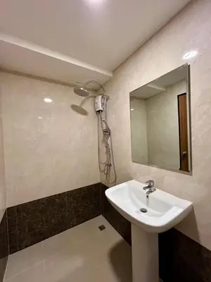 a bathroom with a sink and a mirror at Hillside-Seashore Space Mai Khao Beach in Mai Khao Beach