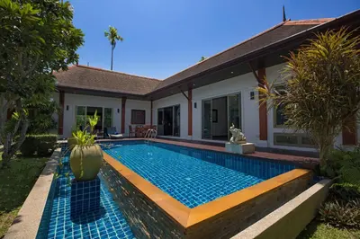 a swimming pool in the backyard of a house at Private 3BR Pool Villa Mylico 3min drive Nai Harn Beach in Rawai Beach