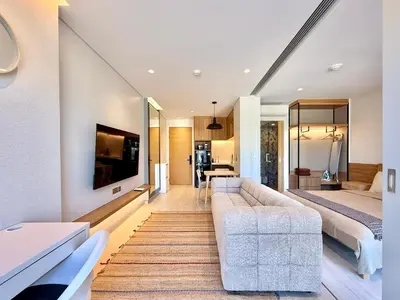 a living room with a couch and a bed at Laguna Lakeside by Villacarte in Bang Tao Beach