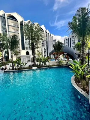 a large swimming pool in front of some buildings at MO607 1 br 36m in Nai Yang Beach