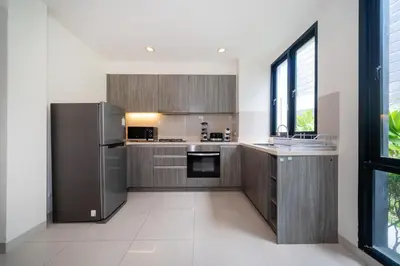 a kitchen with stainless steel appliances and a window at Luxury 5 bedroom villa Laguna Park in Laguna Phuket