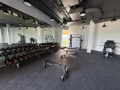 a gym with several treadmills and machines in a room at Bangtao Studio Bellevue Lagoon 6floor pool view in Laguna Phuket
