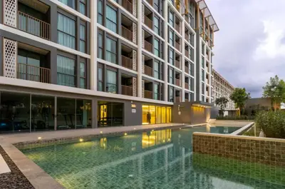a swimming pool in front of a building at The Ozone Condominium B130 Laguna in Laguna Phuket