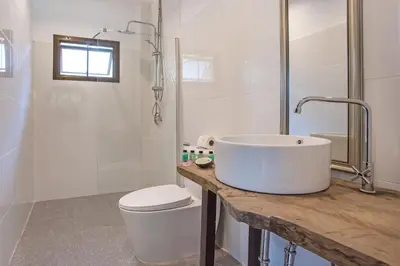 a bathroom with a sink and a toilet and a shower at Oxavia Garden Bungalow B1 -B2 Nai Harn in Rawai Beach