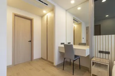 a bathroom with a desk and a chair and a mirror at C247 Brand-New Condo with Pool, Gym & Beach Nearby in Thalang