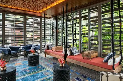 a room with couches and tables in a store at Keemala - Clay Pool Cottage in Kamala Beach