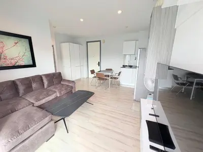 a living room with a couch and a table at The closest accommodation next too central Mall in Ban Rangeng