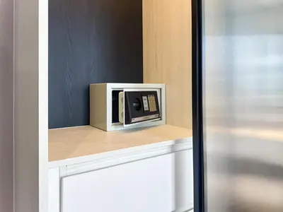 a microwave sitting on a shelf in a room at Amazing 1Bdr Title Legendary Bang Tao in Bang Tao Beach