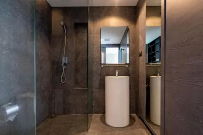 a bathroom with two sinks and a shower at Deluxe 1BR Pool view 58SQM in Kamala Condo Citygate P302 in Kamala Beach