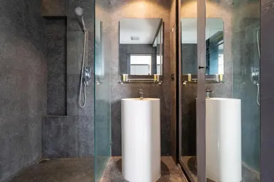 a bathroom with two white tanks in a shower at 1BR Mountain View Condo Citygate P708 in Kamala Beach