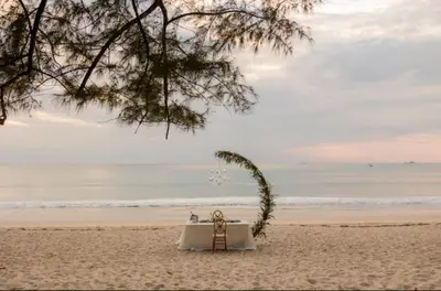 a wedding table on the beach with avationsenalsenalsenalsenalsenalsenalsenal at Sunshine Layan Beach Resort 2 bedroom #84192 in Layan Beach