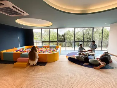 a group of people laying on the floor in a room at Sunshine Layan Beach Resort 2 bedroom #84192 in Layan Beach