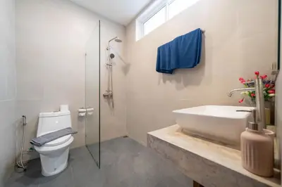 a bathroom with a sink and a toilet and a shower at Villa Mangosteen 3BR Seaview Pool and Rooftop in Ban Saiyuan (1)