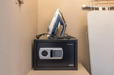 a phone sitting on top of a small refrigerator at Suite Ostia with Gym Pool Access-Bellevue Lagoon in Laguna Phuket