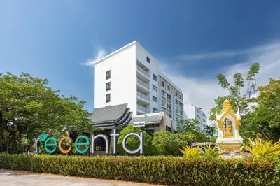 a hotel with a sign in front of a building at Recenta Phuket Suanluang by Deevana in Phuket Town