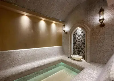a bathroom with a tub with a sink and a window at Layan Green Park Studio by Search Estate in Phuket