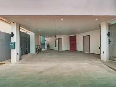 a large empty room with a bike in a building at Lakeside 5-BR New Pool Villa in Gated Community in Chalong
