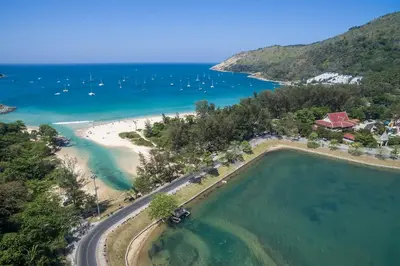 an aerial view of a beach with boats in the water at The Lago Nai Harn 2 Bedrooms by ALL HOMES in Rawai Beach