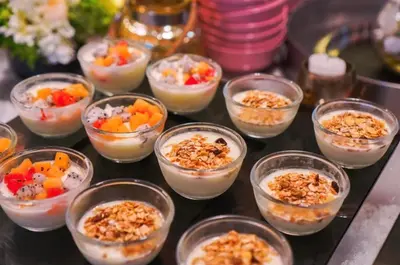 a table topped with plastic cups filled with food at Private Villa at Mida Grande Resort in Surin Beach