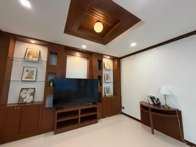 a living room with a large flat screen tv at Cozy Siray Phuket 3-Floor Seaview Family Home in Ban Lo Ti Pa (1)