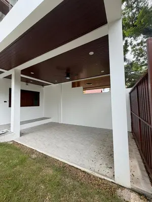 an empty patio of a house at Cozy Siray Phuket 3-Floor Seaview Family Home in Ban Lo Ti Pa (1)