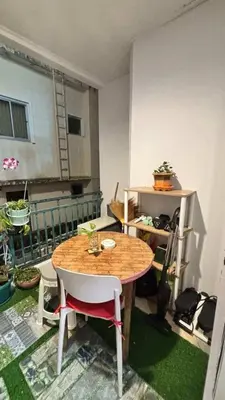 a room with a table and chairs in a room at 209 Patong loft condominium in Patong Beach