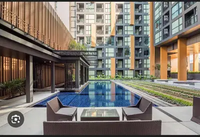 a swimming pool in the middle of a building at Elegant Stay with 360 degree Panoramic Rooftop Pool in Ban Sam Kong