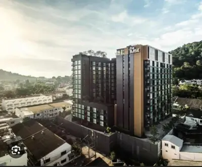 an overhead view of a tall building in a city at Elegant Stay with 360 degree Panoramic Rooftop Pool in Ban Sam Kong