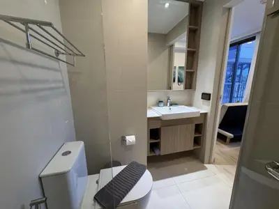 a bathroom with a toilet and a sink at Private apartment at Skypark in Laguna by Lofty in Laguna Phuket