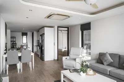 a living room with a couch and a table at 2BR Penthouse with Private Pool Rooftop Absolute Twin Sands 5404 in Patong Beach